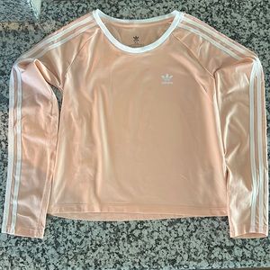 Adidas Girls peach color shirt with white stripes, size XL.